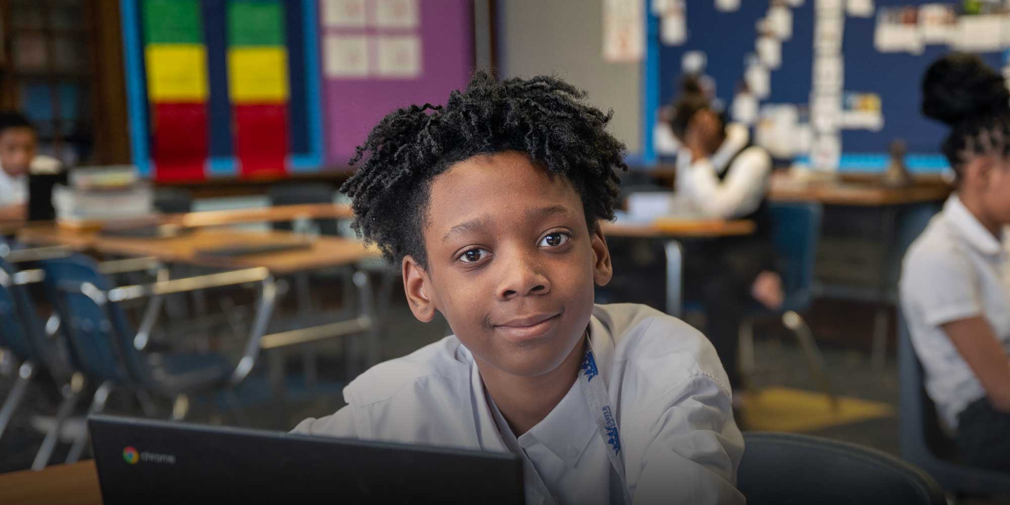 Student working on computer at desk